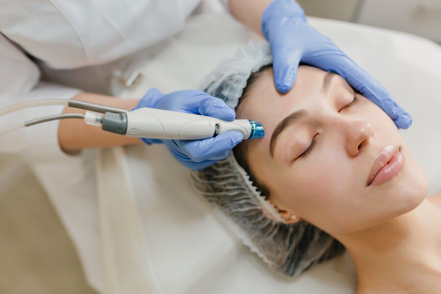 Client relaxing in the treatment room at Ava Aesthetics